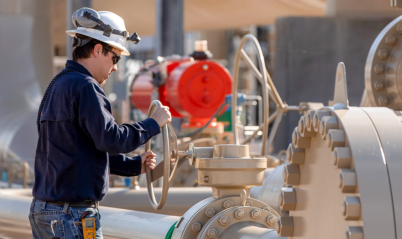 A midstream worker working safely at a Blue Mountain Midstream plant
